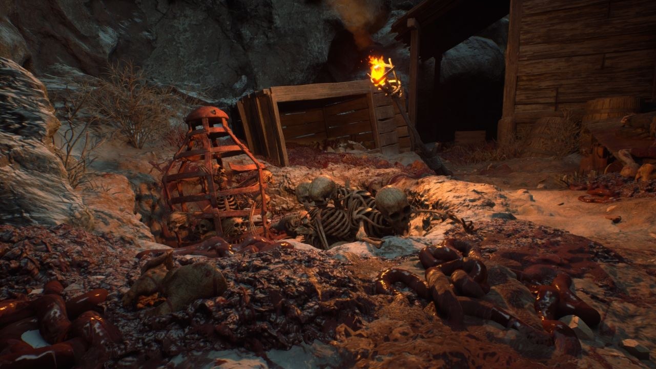 Skeletons are posed so they seem to be crawling out of a shallow pit in some reddish soil.