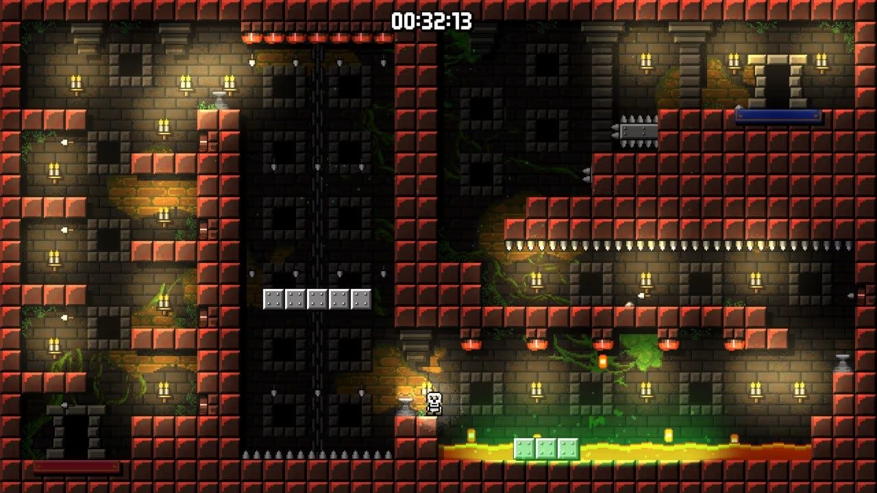A skeleton stands on safe ground, between a bed of lava and a bed of spikes.