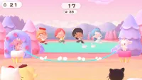 Four characters are lined up in a row and have leaped into the air to hop a jump rope that is presently swinging beneath them.